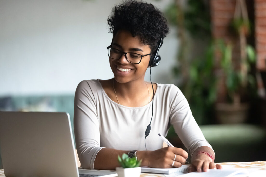 A woman working at a computer.