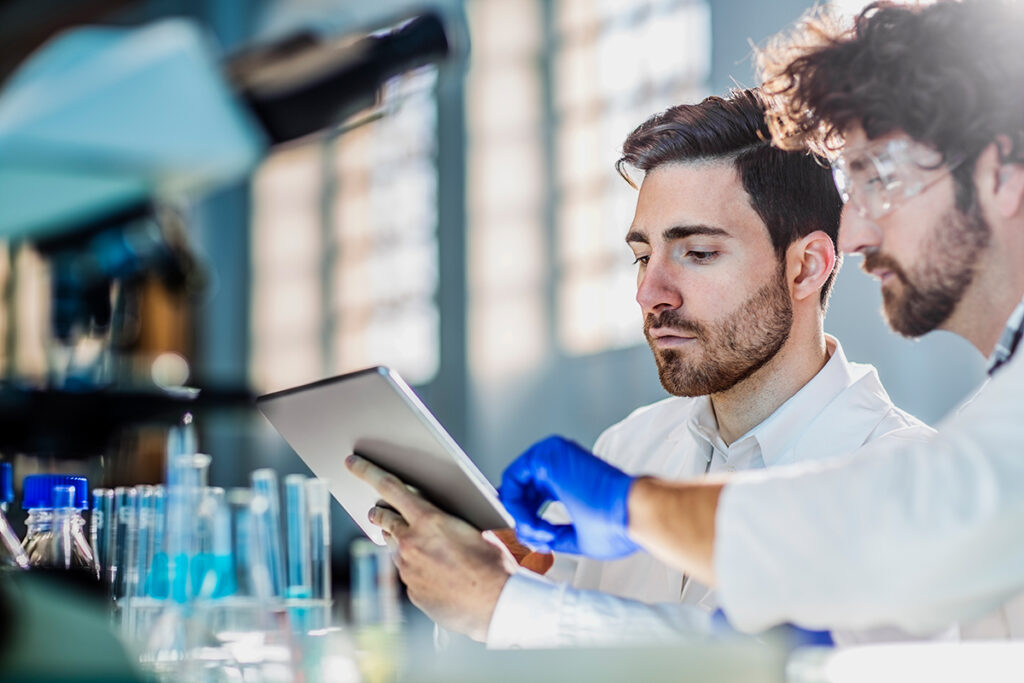 Two lab workers talking