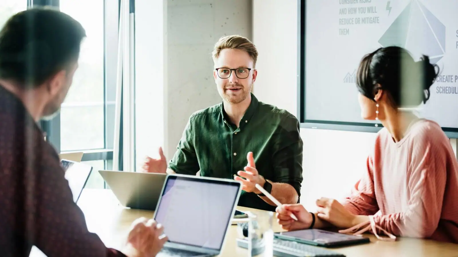 Business leaders discussing an AI roadmap around a table