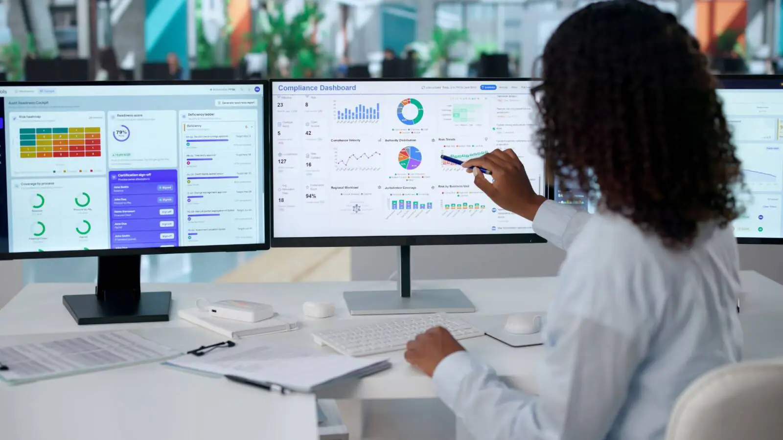 Life sciences compliance team reviewing audit trail data with AI-assisted exception reporting tools