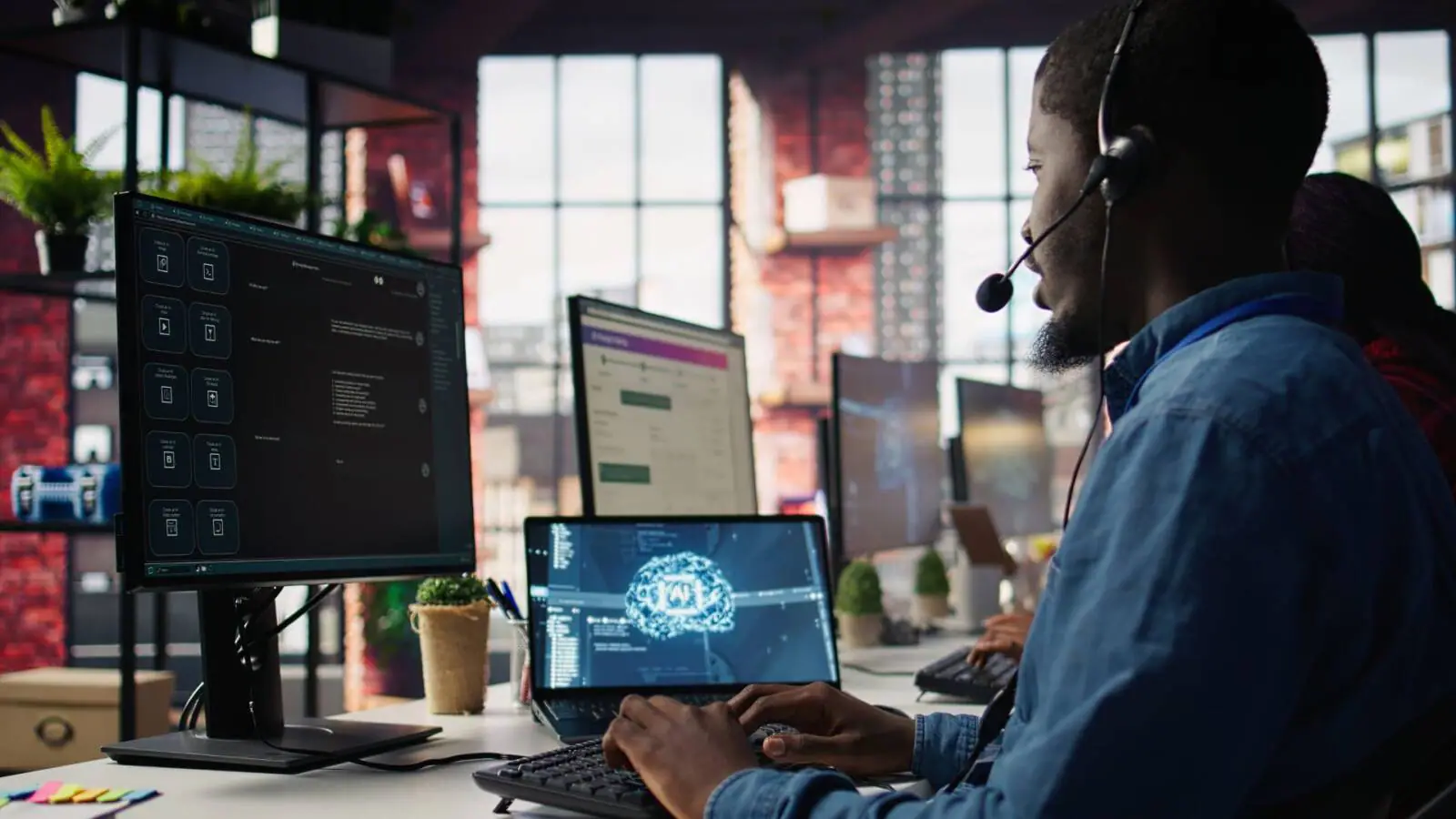 A man working at a workstation with multiple monitors displaying cloud architecture diagrams and AI system dashboards, representing AWS cloud migration and AI-readiness.